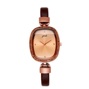 Elegant oval rose gold watch for women with brown leather strap and crystal accents