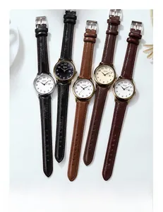 Close-up of retro GEDI leather watches with round metal dials and colorful straps