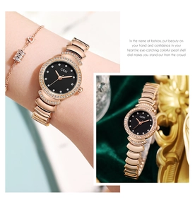 Gros plan de la montre quartz en or rose avec cadran noir et strass sur velours
