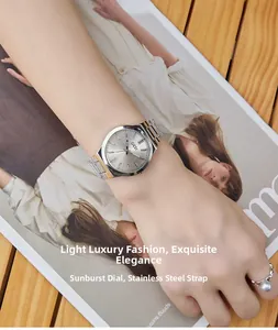 Detail of silver stainless steel strap and sunray dial on elegant women's quartz watch