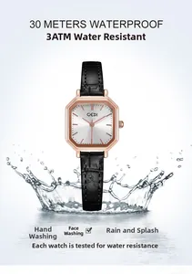Waterproof detail of rose gold octagonal watch with black leather strap and water splash