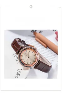 Detail of Gedi vintage watch with brown leather strap and rose gold champagne dial