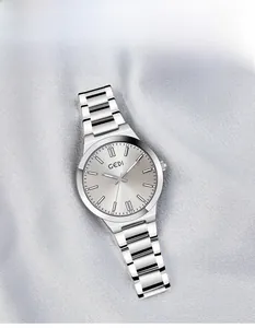 Close-up of GEDI silver quartz watch with sunray dial on grey fabric background