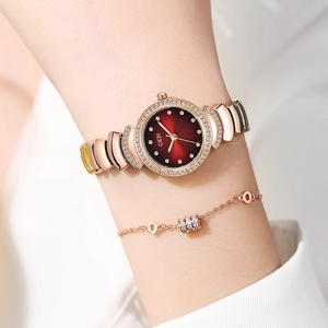 Coffret montre Gedi élégante pour femme en or rose avec cadran rouge et cristaux