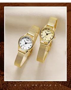 Detail of vintage ladies quartz watches with gold mesh straps and Roman numerals