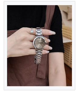Close-up of GEDI women's watch with champagne dial and silver stainless steel strap