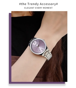 Elegant ladies' silver steel watch with a vibrant purple sunray dial worn on wrist
