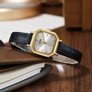Vintage octagonal gold watch with silver dial and black leather crocodile strap