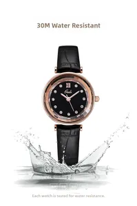 Detail of 3ATM waterproof watch with black leather strap splashing in water effects