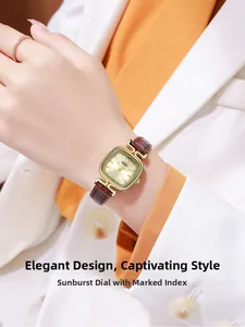 Detail of GEDI square gold watch with champagne dial and brown leather strap on wrist