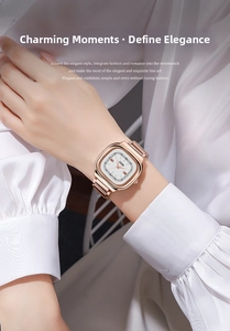 Detail of rose gold rectangular watch with white dial and orange hands on a female wrist
