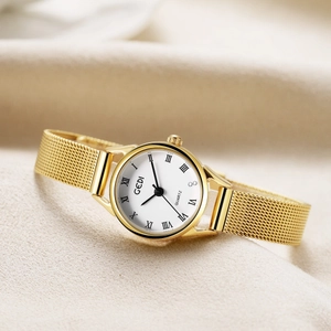 Retro women's gold quartz watch with a stainless steel mesh strap on satin fabric