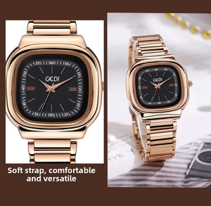 Detail of GEDI rose gold square watch with black dial and polished metal strap