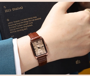 Detail of GEDI rectangular quartz watch with brown crocodile leather strap on wrist