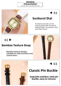Detail of sunray dial with square gold case and leather strap on warm background