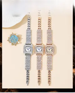 Three luxury square quartz watches in silver, rose gold, and gold with rhinestone details