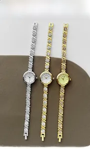 Detailed view of luxury bracelet watches with rhinestone inlay in silver and gold tones