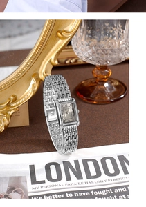 Detail of GEDI rectangular silver quartz watch with a textured metal chain strap