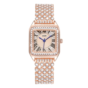 Detail view of square rose gold watch with sparkling crystals and Roman numeral dial
