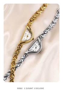 Detail of GEDI quartz watch with crescent D-dial and X-link bracelet on silk cloth