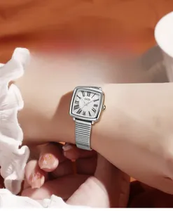 Detail of luxury women's square watch with mother-of-pearl dial and silver metal strap