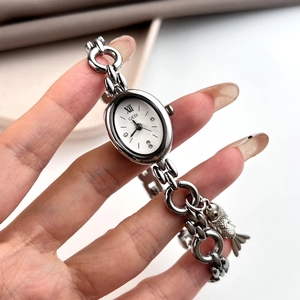 Elegant silver oval quartz watch for women with chain strap and fish charm detail