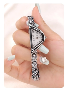 Detail of GEDI silver chain watch featuring a unique crescent shield dial and link strap