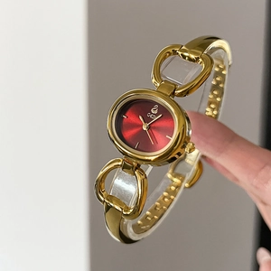 Elegant gold oval bracelet watch for women with a deep red sunray dial by GEDI