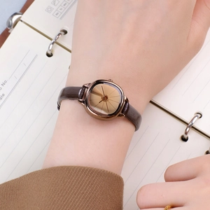 Vintage women's square quartz watch with brown leather strap and champagne sunburst dial