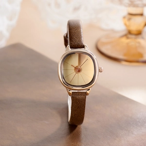 Elegant vintage square gold watch for women with slim brown leather strap and minimal dial
