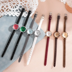 Elegant minimalist women's quartz watch collection with slim faux leather straps in seven colors