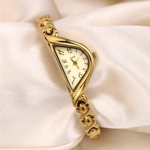 Luxurious GEDI vintage gold women's watch with asymmetric case on soft silk fabric