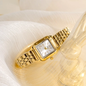 Elegant gold square quartz watch for women with Roman numerals on white silk background