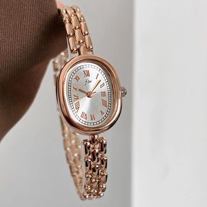 Elegant rose gold oval watch with silver sunray dial and vintage metal chain strap