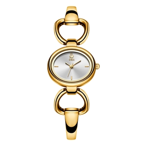Elegant gold-tone women's bracelet watch with heart-shaped links and oval silver dial