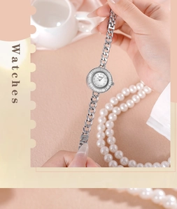 Close-up of GEDI ladies' watch with silver chain strap and shimmering mother-of-pearl dial