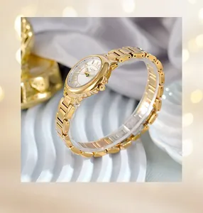 Detail view of gold women's steel watch with Roman numerals on elegant white wave stand