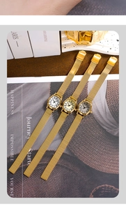 Close-up of three elegant tonneau women's watches with gold mesh straps and roman numerals
