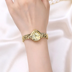 Elegant gold quartz watch for women with wheat ear strap on white silk and pearls