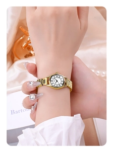 Close-up of elegant gold tonneau watch with Roman numerals and stainless steel strap
