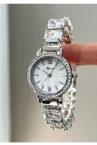 Detailed macro of crystal strap quartz watch with mother of pearl dial for women
