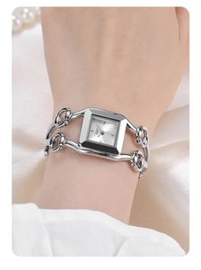 Macro view of silver square GEDI quartz watch with stylish bracelet chain for women