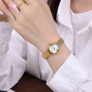 Elegant gold tonneau watch for women with white Roman dial and stretch snake chain strap