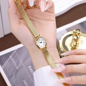 Elegant GEDI gold tonneau watch for women with Roman numerals and expansion band