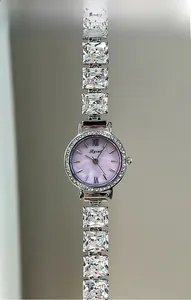 Detail of lavender pearl dial watch with square zircon bracelet and crystal bezel