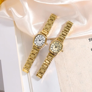 Elegant gold tonneau watch for women with Roman numerals and classic metal strap