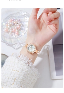Elegant ladies quartz watch with pearl bracelet strap and floral dial details