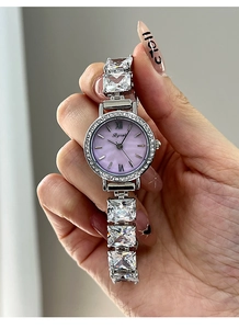 Detailed shot of ladies' silver watch with violet dial and square zircon inlaid strap