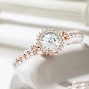 Elegant rose gold women's watch with mother-of-pearl dial and white pearl bracelet band
