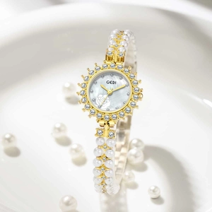 Elegant women's watch with white pearl bracelet strap and sparkling rhinestone dial case